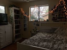 the bedroom is decorated with lights and decorations