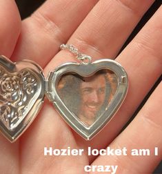 a heart shaped locke is shown with the words, hozier locke am i crazy