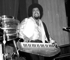 a man that is sitting in front of a keyboard