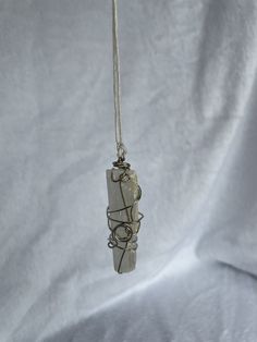 Handmade Selenite Stick hanging decoration wire wrapped. Great to hang in a car or in a window. Selenite has great restorative properties, and can clear out negativity. It also acts as a cleanser for other gemstones. Spend $35 or more at this shop for free shipping. White Pendant Crystals For Gift, Selenite Stick, In A Car, Crystal Items, A Car, Hanging Decor, Wire Wrapped, Wire Wrapping, Give It To Me