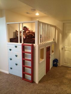 a child's bedroom with a loft bed and stairs to the second floor is shown