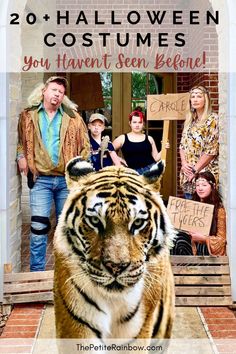 people are standing in front of a door with a tiger on the steps and one is holding a sign