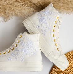 '' Custom Embroidered Converse Platform, Sneaker Platform Embroidered White Flower, Personalized Bridal Shoes for Wedding '' 🍀 Price includes Converse Shoes and Floral Embroidery Designs as shown 🍀 🍀 Shoe Type: Converse Platform 🍀 Shoe color: 22. White_gold chain 1. DETAILS 🍀 You can send me your Converse, Vans, canvas shoes or I can buy them for you. Custom-ordered embroidered Vans and Converse shoes, please wait another 2-4 days. Each pair is hand embroidered to order, please make sure you put in the correct shoe size before you check out. The embroidery is meticulous and does not fade. 🍀 You will receive Vans and Converse shoes with floral embroidery designs as above. 2. PERSONAL EXPRESSION 🍀 Create your unique vibe by your own design of embroidery! In addition to the embroidery Bridal Converse Custom, Wedding Converse Clogs & Mules, Sneaker Wedding, Embroidered Vans, Embroidered Converse, Converse Platform, Bride Flower, Wedding Converse, Embroidered Shoes