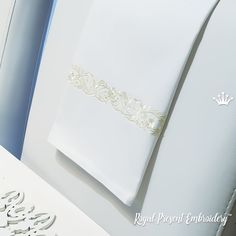 a close up of a folded wedding card on a table