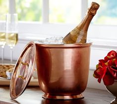 a bottle of champagne is in an ice bucket