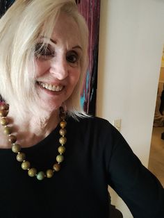 "This is a gorgeous, one of a kind, statement necklace designed and hand crafted personally by Petronella Greer.  It's a 1 strand design, made of natural round green turquoise beads with silver toned accent beads. Each round green turquoise stone is a little over 1/2\" wide.  The necklace is itself is 22\".  The clasp is high quality. It's an exquisite and unique piece of turquoise jewelry that no one else will have but you!  Also, comes in very nice packaging!" Elegant Green Beaded Necklaces With Wooden Beads, Elegant Green Beaded Necklace With Wooden Beads, Elegant Green Wooden Beaded Necklaces, Round Wooden Beads Necklaces For Jewelry Making, Wooden Beads Necklaces For Jewelry Making, Nature-inspired Necklace With Large Beads For Gifts, Unique Single Strand Beaded Necklace, Green Jewelry With Wooden Beads, Green Wooden Beads Jewelry