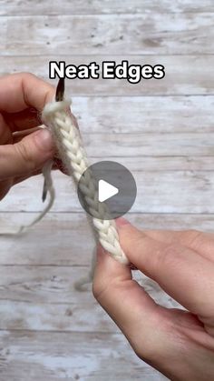 someone crocheting the end of a piece of white yarn with their thumbnails