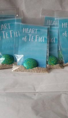 three bags filled with sand and sea shells