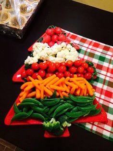 there are many vegetables on the table ready to be cut and put into serving platters