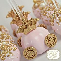 pink and gold cake pops with golden crown decorations