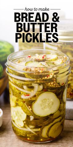 a jar filled with pickles sitting on top of a wooden table