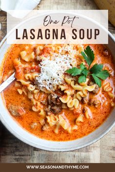 one pot lasagna soup in a white bowl with parmesan cheese on top