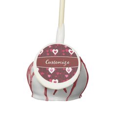 a toothbrush holder with hearts on it and the words customize written in red