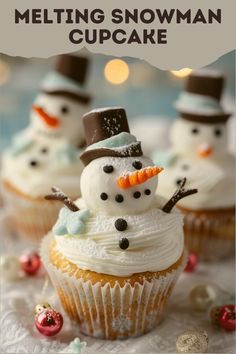 some cupcakes with frosting and snowmen on them are sitting next to each other