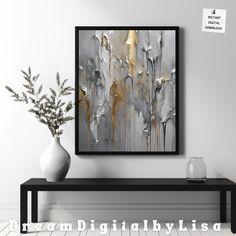 an abstract painting on the wall next to a vase with a plant in it and a sign that says dream digitalyllisa