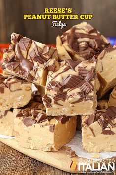 peanut butter cup fudge bars stacked on top of each other