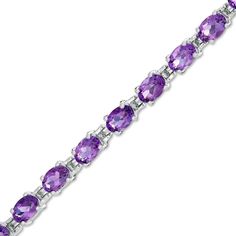 Amaze her with this gorgeous gemstone tennis bracelet. Created in sterling silver, this attractive choice showcases a row of 6.0 x 4.0mm oval-shaped bright purple amethyst. Buffed to a brilliant luster, this 7.25-inch bracelet secures with a box clasp. Box Clasp, Amethyst Jewelry, Bright Purple, Purple Stones, Amethyst Stone, Gemstone Bracelets, Tennis Bracelet, Stone Bracelet, Birthstone Jewelry