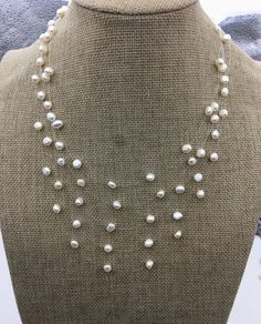 "quantity: 1 pc pearl jewelry: floating pearl necklace pearl body: please look at picture necklace length: 16.5''+2''extends pearl grade:AA+ pearl luster:high pearl shape:baroque pearl size: 6-7mm pearl colour: white packaging: beautiful pouch ---All style of illusion necklace--- https://www.etsy.com/hk-en/shop/WenPearls?ref=hdr_shop_menu&search_query=NPN3 Back to Other Jewelry Section 01: \"Tahitian,Akoya,Sea Pearl\" Section: https://www.etsy.com/shop/WenPearls?section_id=15806339 02: \"Potato/ Multi-strand Pearl Drop Necklace, Pearl White Multi-strand Pearl Necklace, Multi-strand Pearl White Necklace With Pearl Pendant, White Double Strand Pearl Layered Necklace, Multi-strand Pearl Necklace With Pearl Charm, White Pearl Double Strand Layered Necklace, Adjustable Multi-strand Pearl Necklace, Delicate Double Strand Pearl Necklace, Adjustable Double Strand Pearl Drop Necklace