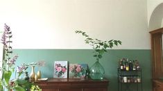 a living room filled with furniture and lots of plants