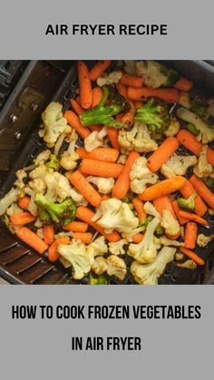 an air fryer with carrots, cauliflower and broccoli in it