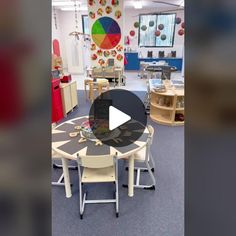 an image of a classroom setting with tables and chairs