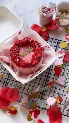 a heart shaped cake sitting on top of a table