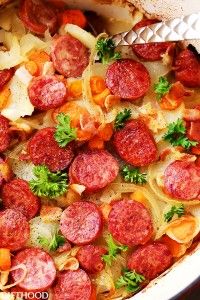 a pan filled with cooked sausage and vegetables