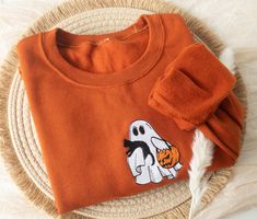 Embroidered Boo Haw Ghost Sweatshirt Stay cozy and spooky at halloween with this cute minimalist soft and warm embroidered fall sweatshirt! Made with love and THOUSANDS of threads! -Unisex Size (Please see the size chart for more details that can be found in the photos section)  We recommend comparing your favorite sweatshirt to our size chart to find the best size for you! Unisex Crewneck Sweatshirt: -50% cotton 50% polyester -Super soft -Pre-shrunk -Unisex -Pumpkin size is 1.5"" (tiny but migh Embroidered Ghost, Fall Crewneck, Ghost Sweatshirt, Cozy Fall Outfits, Sweatshirt Trendy, Sweatshirt Halloween, Cat Sweatshirt, Trendy Fall, Halloween Sweatshirt