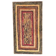 an area rug is shown with red, yellow and green colors on the floor or wall