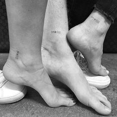 two people standing next to each other with tattoos on their legs and feet that say, i love you