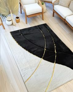 a black and white area rug in a living room