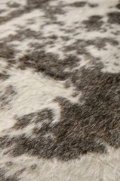 a close up view of an animal print area rug