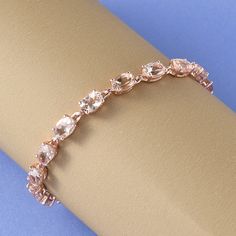 This Marropino morganite tennis bracelet is beautifully crafted to suit your fashion needs. Made from sterling silver, the morganite bracelet is studded with Marropino morganite ovals set securely in the prong setting. Rose gold vermeil on its durable sterling silver frame intensifies the rosy hues of this bracelet and makes it look more luxurious. Morganite is one of the strongest heart stones that you can get your hands on. This special Beryl variety offers up pure love and compassionate energ Morganite Bracelet, Morganite Jewelry, Rose Gold Morganite, Wedding Jewelry Bracelets, Wedding Bracelet, Silver Frame, Tennis Bracelet, Morganite, Chain Link Bracelet