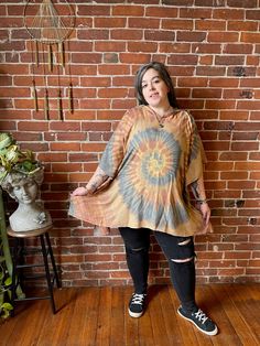 Stay cool and covered in Tie Dye with the Free Size Spiral Poncho Hoodie! Made of flowy rayon, this hoodie features armholes for a comfortable fit up to size 3X. Perfect for any boho festival or casual day out. Bust up to 55" around Arm circumference up to: 21" 30" long shoulder to hem 100% rayon hand wash gently, Air Dry Please take a moment to look over all shop policies before purchasing. Tie Dye Cotton Top With Drawstring Hood, Tie Dye Hooded Cotton Top, Tie-dye Tops With Drawstring Hood For Spring, Hooded Tie-dye Cotton Tops, Long Tie-dye Bohemian Kimono, Boho Festival, Free Size, Tie Dye, That Look