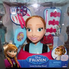 the frozen princess doll is in its box and has hair clips on it's head