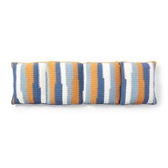 two orange and blue striped pillows sitting on top of each other