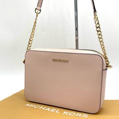 Brand New With Tag Michael Kors Ew Crossbody Bag Color: Powder Blush Gold Tone Hardware Black Leather /Pvc 9.5"(L) X 6.5"(H) X 2.25"(D) Adjustable Chain & Leather Strap With Appx. 22" Drop Top Zip Closure Interior 1 Large Padded Pocket & 1 Slip Pocket Mk Logo Lettering On Front & Interior Mk Signature Fabric Lining Does Not Include Dust Bag! Trendy Pink Michael Kors Shoulder Bag, Trendy Pink Michael Kors Bag, Michael Kors Blush Rectangular Bag, Michael Kors Blush Crossbody Bag, Michael Kors Pink Crossbody Bag, Blush Gold, Asics Running Shoes, Mk Logo, Drop Top