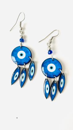 Hamsa Evil Eye Women Earrings Gift Fashion Jewelry Dangling  Beautiful women earrings, evil eye for protection and good luck,  very light weight, modern. Length:  2 inches Materials: Bras  Closure: Ear wire Handmade item We ship within 1 business day. Sterling Silver Evil Eye Dangle Earrings, Blue Sterling Silver Evil Eye Earrings, Metal Dangle Earrings With Evil Eye, Blue Evil Eye Dangle Earrings, Bohemian Evil Eye Earrings As Gift, Blue Round Evil Eye Earrings, Silver Round Evil Eye Earrings, Blue Evil Eye Earrings, Hamsa Evil Eye