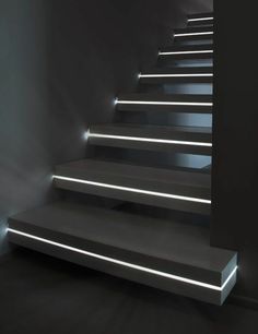 the stairs are lit up with white lights