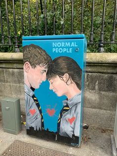 a blue box with two people painted on it