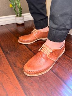 These genuine leather huaraches are handmade by artisans in Central Mexico. As a result, minor blemishes that do not take away from the appeal of the huaraches but instead speak to its handicraft, may be visible. They are woven using fine strips of genuine leather. This style of huarache sandal compliments casual looks paired with denim, chinos, and shorts. Another great combination is to wear the huaraches with a light blazer and linen or cotton blend dress pants. Sizing If you normally wear a Artisan Slip-on Huaraches With Woven Sole, Hand Tooled Brown Artisan Huarache Sandals, Artisan Brown Hand-tooled Huarache Sandals, Artisan Hand-tooled Brown Huarache Sandals, Traditional Leather Huarache Sandals With Woven Sole, Artisan Huarache Sandals With Stitched Sole, Traditional Woven Leather Huaraches, Traditional Leather Woven Huaraches, Artisan Huaraches With Woven Sole