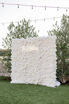 a large white flowered wall with the word love written on it