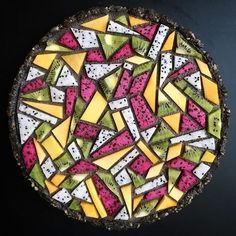 a close up of a pie with many different toppings on it's crust