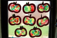 a window decorated with apples and candy bars