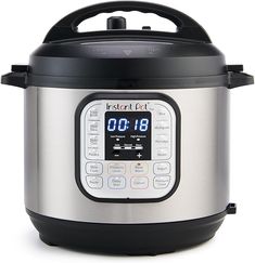 an instant pot is shown with the timer on it's side and its lid open