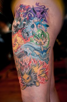 the back of a man's leg with pokemon tattoos on it and various colors