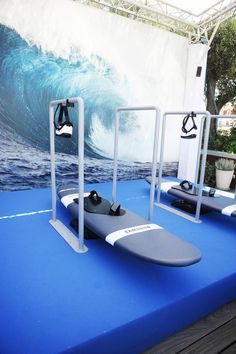 two surfboards sitting on top of a blue platform