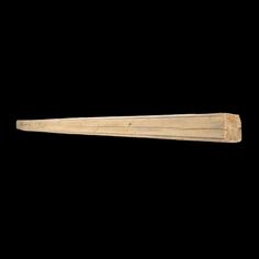 an old wooden baseball bat on a black background