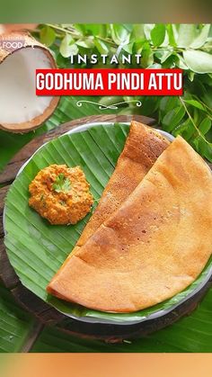 an image of food on a plate in the middle of some leaves and coconuts