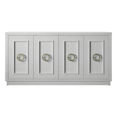 a white cabinet with four doors and three handles